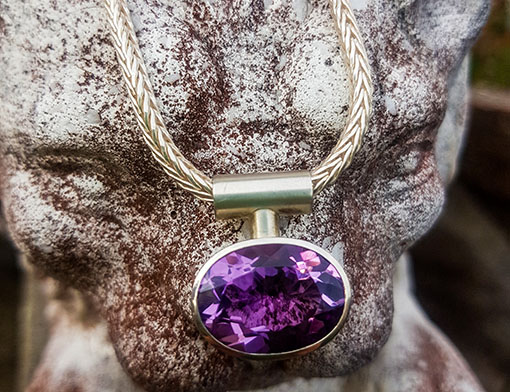 Pendant with a large, silver-mounted amethyst on foxtail chain