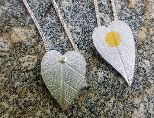 Two pendants made of fine silver on foxtail chain, fine gold or brilliant cut diamond
